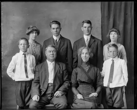 Parents pose with their 3 pairs of twins,1920s, glass negative.