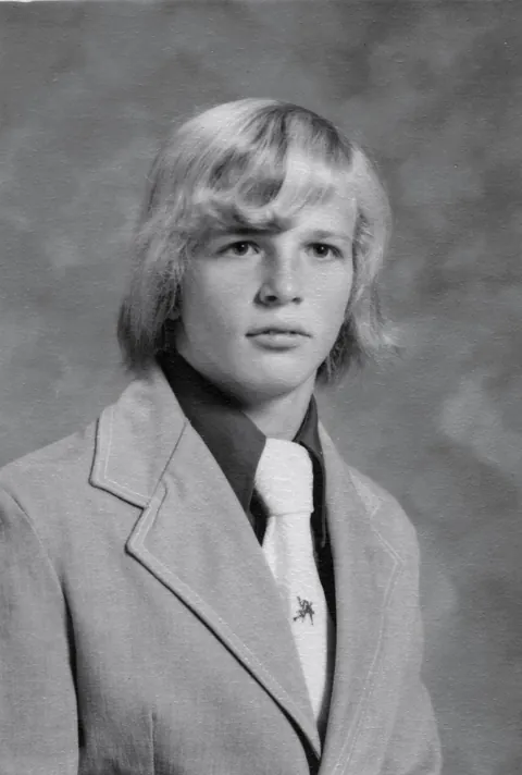 My Senior photo (1975).  Was an A student until my parents Divorce. I did not get my act together until late my sophomore year. There was no money to go to college execpt my savings from working since I was 16 (about $2,000). Nobody wanted an average student!