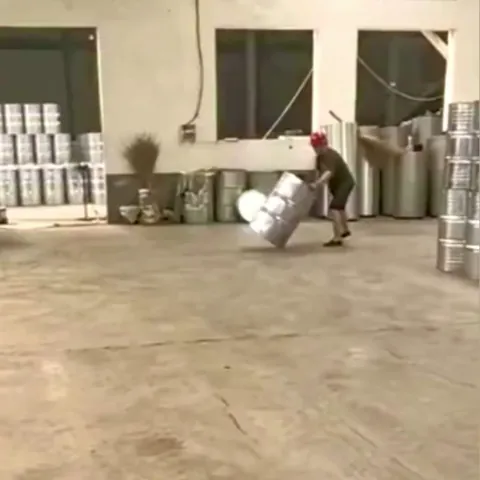 Factory worker spins barrels into place with pinpoint accuracy