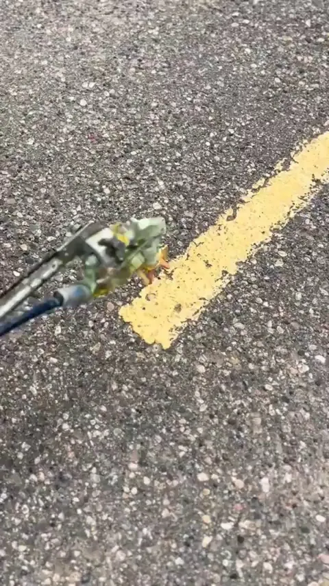 Painting a worn yellow lane line