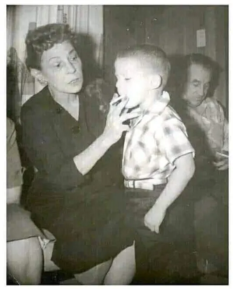 In the 1950s, cigarette smoking was widely accepted.  Advertisements promoted smoking as healthy with claims that it could help with weight management and nerves. This grandma teaching her grandson to smoke was no big deal.
