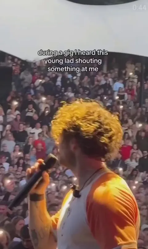 Singer Tom Grennan responds to a young fan