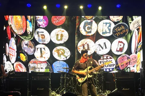 [OC] A photo of Tom Morello playing guitar with a "Fuck Trump" backrop, 17 July 2025