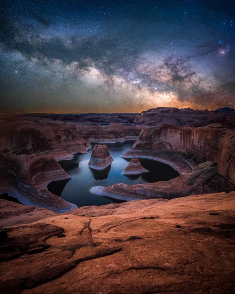 I carried a star tracker through the desert in June to photograph the milky way in one of the darkest places in the US - Reflection Canyon, Utah [OC][1440x1800]