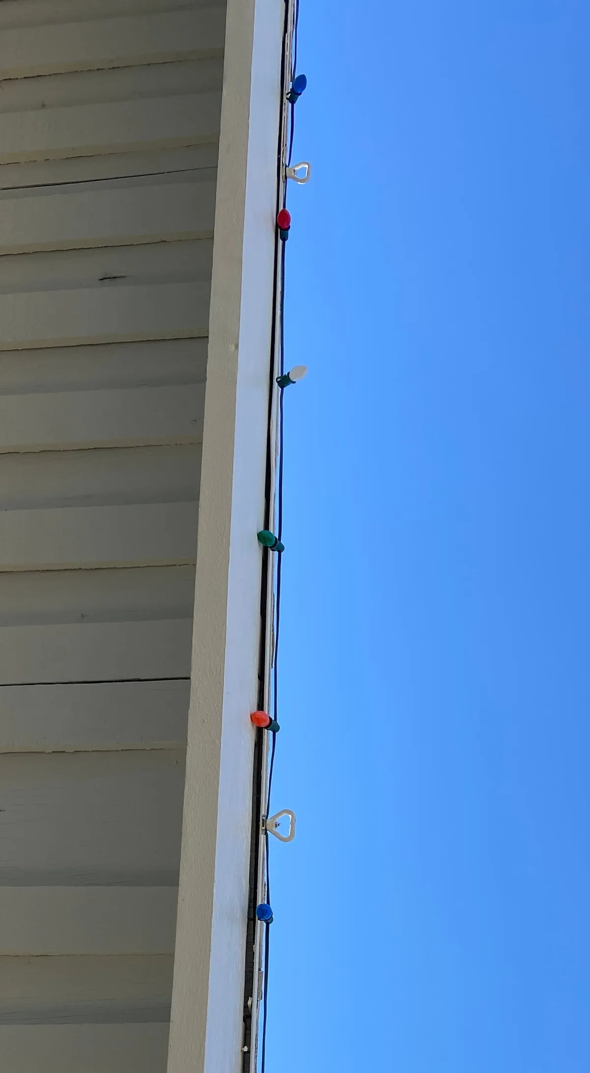 How I hang my Christmas lights with magnets and a long pole