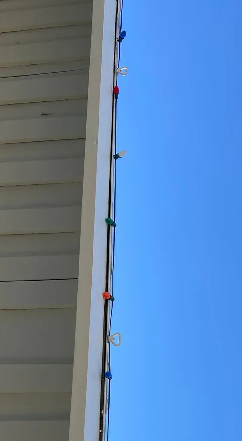 How I hang my Christmas lights with magnets and a long pole