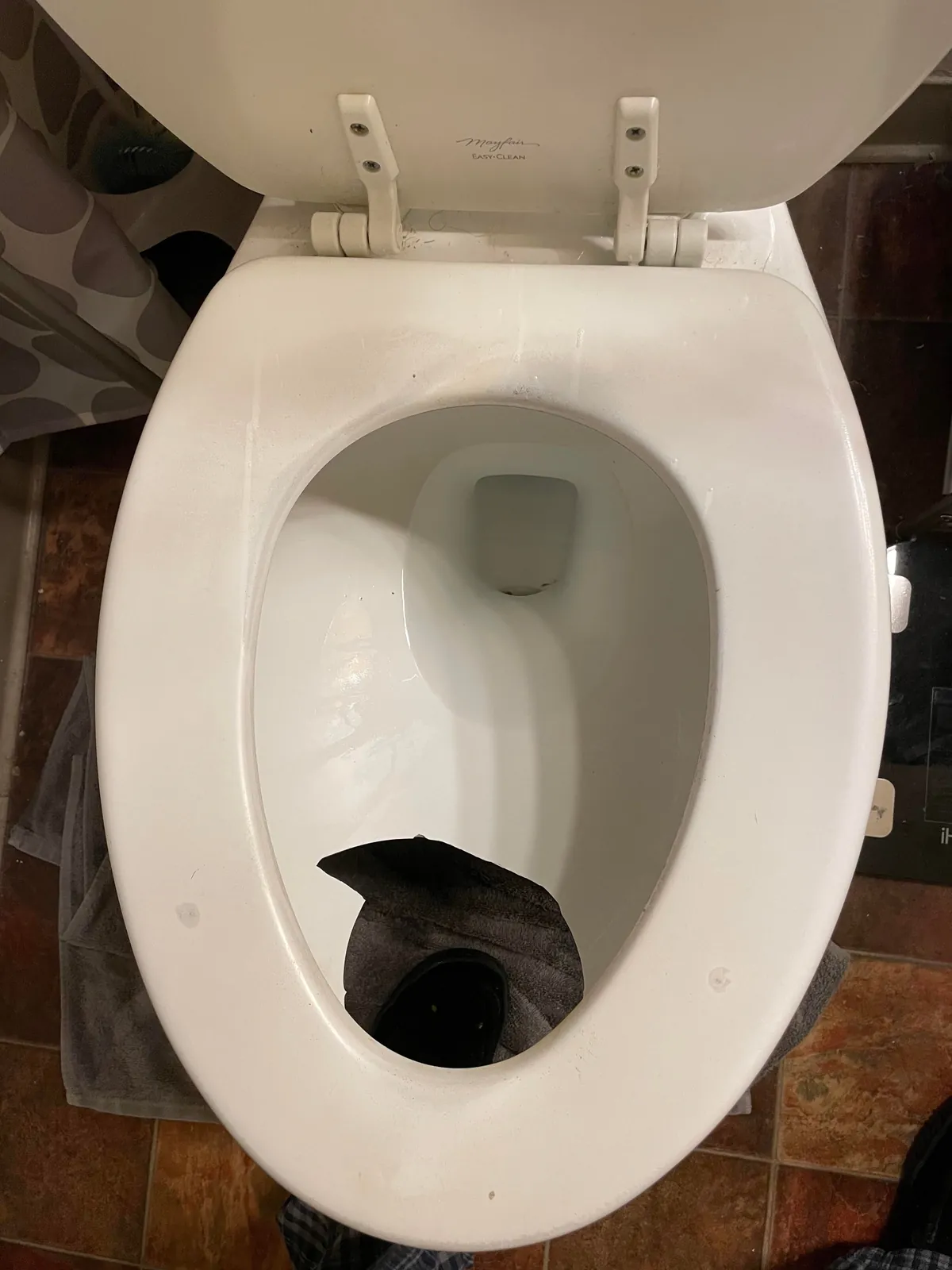 A bottle fell off the shelf and broke straight through our toilet bowl last night