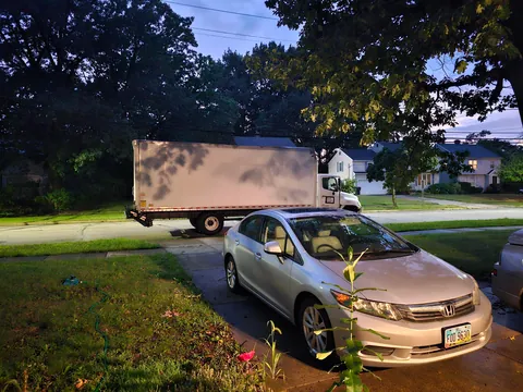 This truck has been parked in front of my driveway for 8 hours.