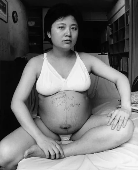 A mother photographs herself and her child over the years, 2001