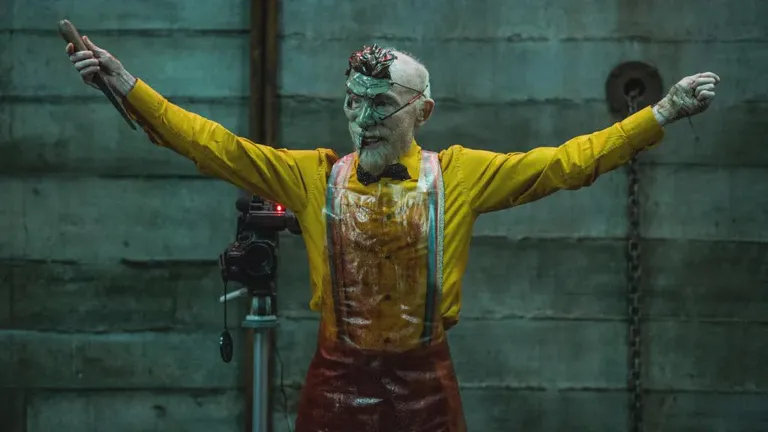 First Image of Jackie Earle Haley in 'Your Host' - Four friends wake up to find themselves trapped in an abandoned factory. Their captor (Haley) is a deranged host in a terrifying mask who forces them to play a deadly game show. The only way to escape is to win.