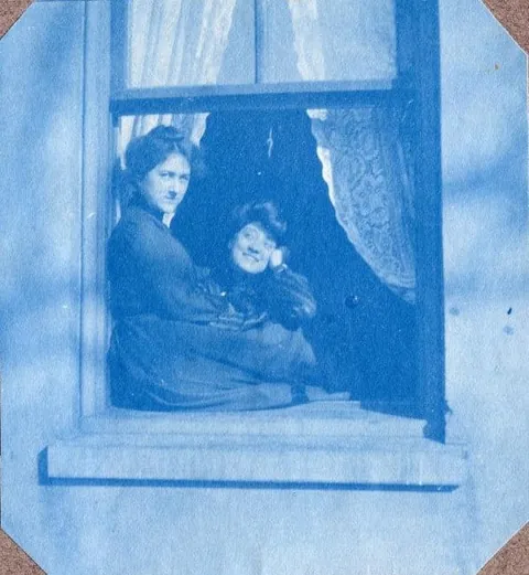 An unnamed young woman recorded her senior year at Asheville Female College in a photo album, Asheville, North Carolina, 1902. It includes a dorm room, group shots of friends, playing in snow, a visit to the mountains, their final midnight party before graduation, and graduation day itself.