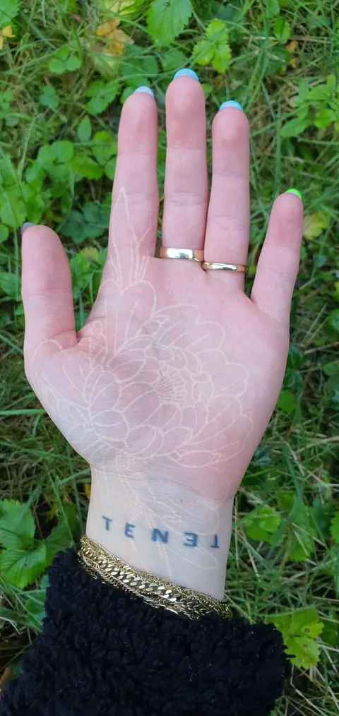 One year healed white palm tattoo by Frederic Mado at høød7 in Hamburg, Germany 