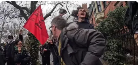 This is the most symbolic photo of the century: an Islamic jihadist climbing on the back of a Marxist useful idiot