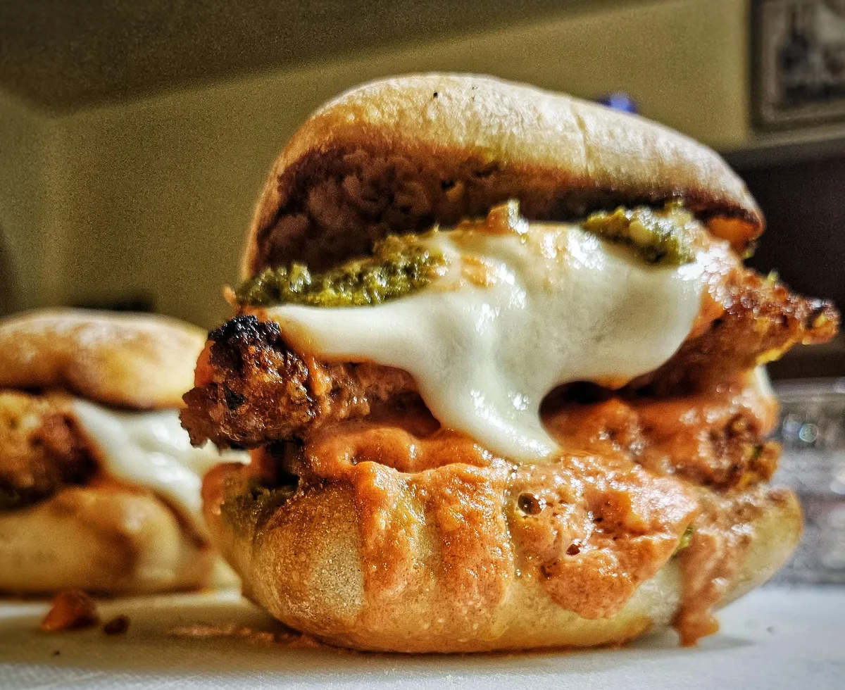 Vodka chicken parm sandwich with pesto and fresh mozzarella.