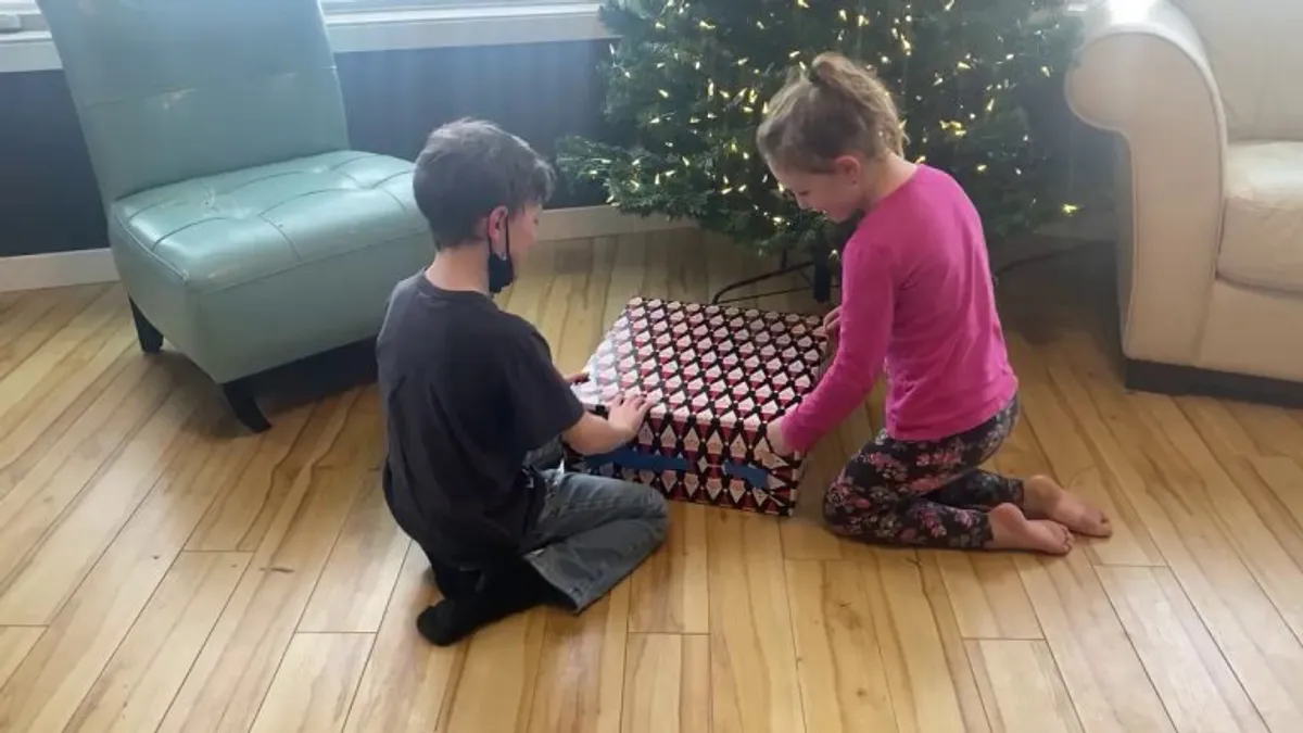 My gamer son got to experience his first ever Christmas console unboxing. My non-gamer daughter, however, was not impressed.