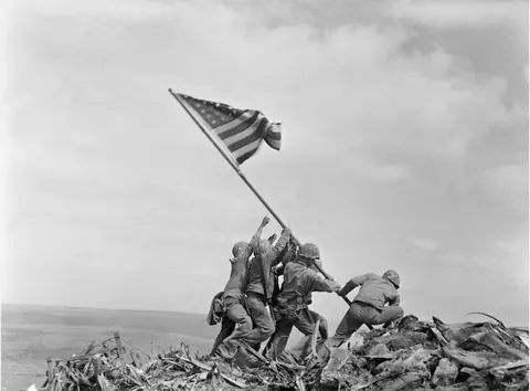Ira Hayes, a Native American marine immortalized raising the American flag over Iwo Jima, sits in a Los Angeles jail cell (1953). Crippling PTSD and unwanted fame saw Hayes arrested 52 times for public intoxication after the war. He froze to death in the Arizona desert while drunk in 1955.