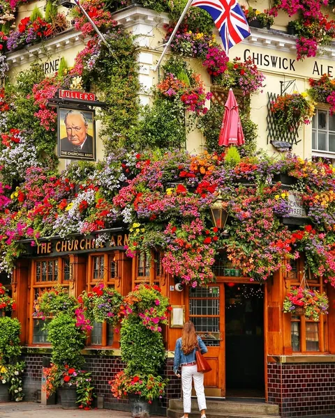 Flower covered pub in Notting Hill, London.