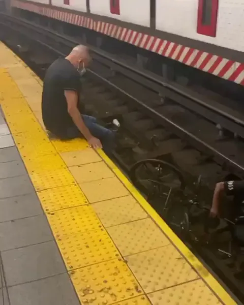 A HERO Just seconds before the train arrived, a good Samaritan jumped onto the tracks to save a man in a wheelchair
