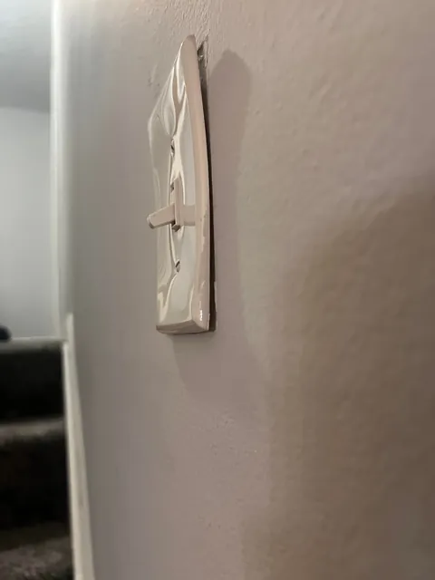 Multiple Light Switch Covers and Outlet Plates Warped at Once — What Could Cause This?
