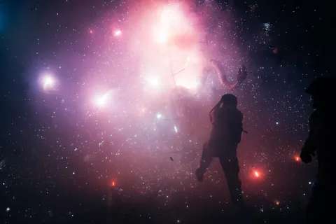 I took this photo of a man jumping into a firework explosion