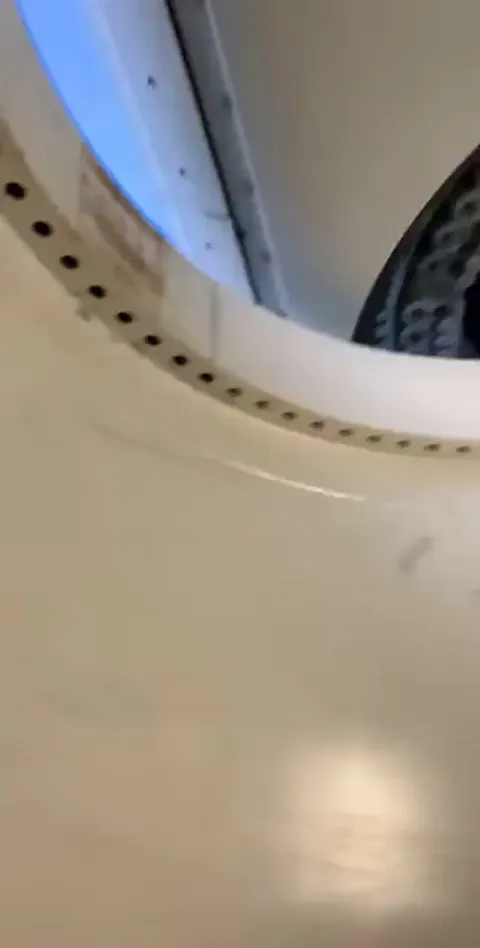 Wind turbine under construction and strong wind