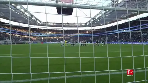 Hugo Ekitike with Frankfurt's club eagle Atilla.