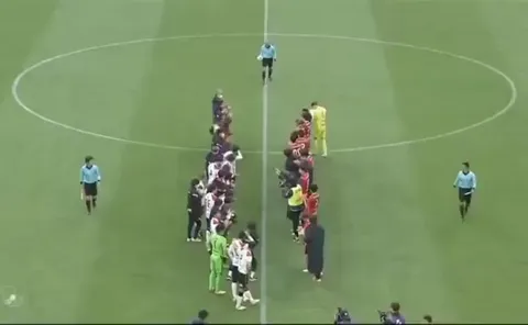 Player removes his shirt so the retiring referee could give him one final yellow card..