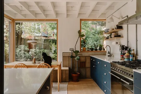 Modern kitchen and dining extension with garden views added to a two-bedroom apartment in a Victorian villa, Willesden Green, northwest London, UK [1600x1067]