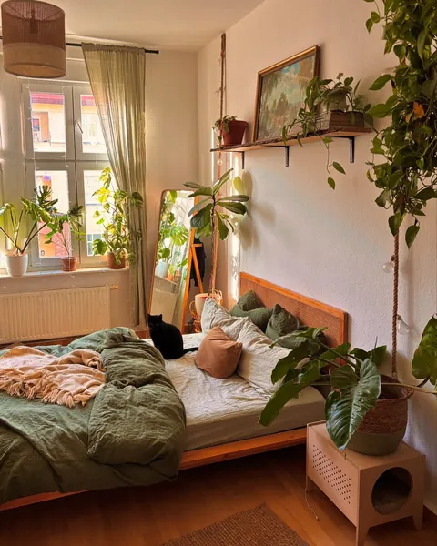 Naturally lit apartment bedroom with many houseplants, Brandenburg, Germany [1440x1800]
