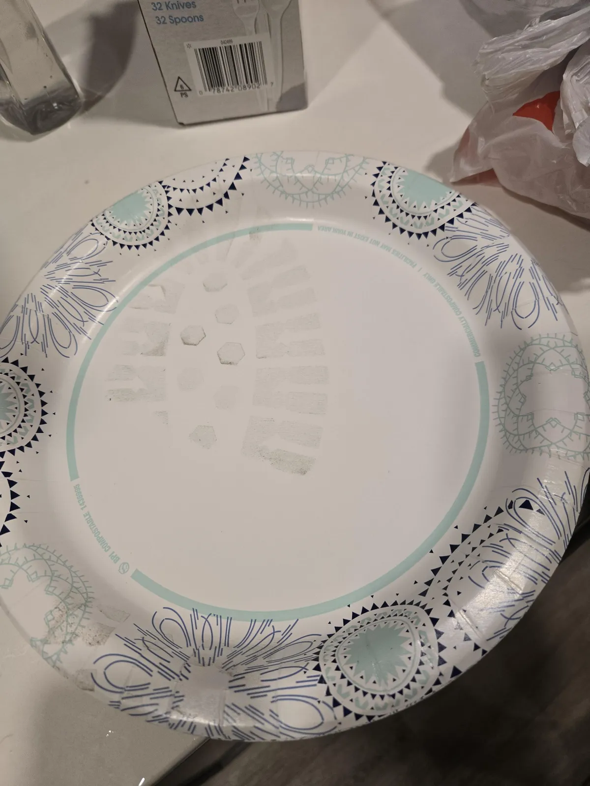 Paper plate from the middle of a new package had a footprint on it.