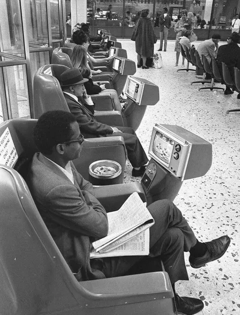 Ashtrays and coin-operated televisions in the Los Angeles Greyhound bus terminal, 1969