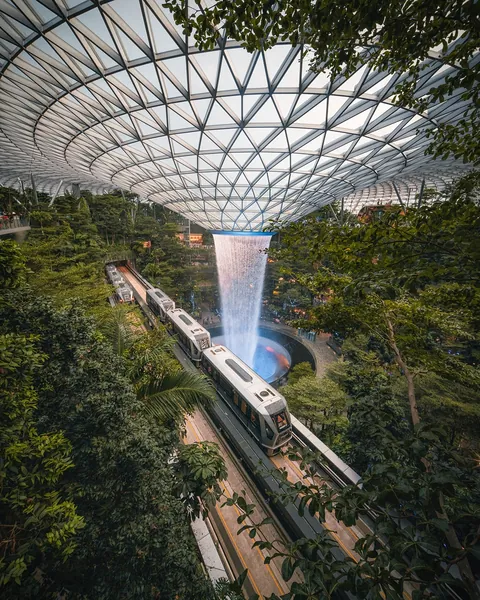 Changi Airport Skytrain tracks next to the Rain Vortex in Jewel Changi Airport, Singapore.