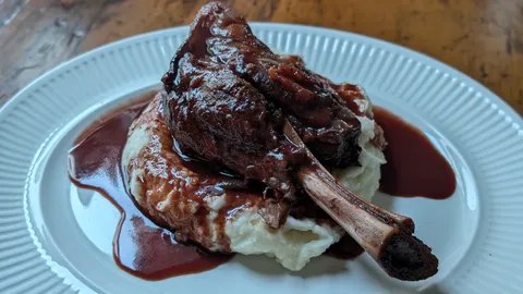 Braised Lamb Shank on Mashed Potatoes with a Red Wine Jus