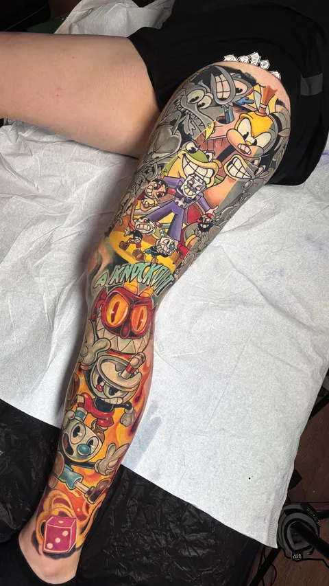 Cuphead leg sleeve by Derek Turcotte in Canmore, Alberta