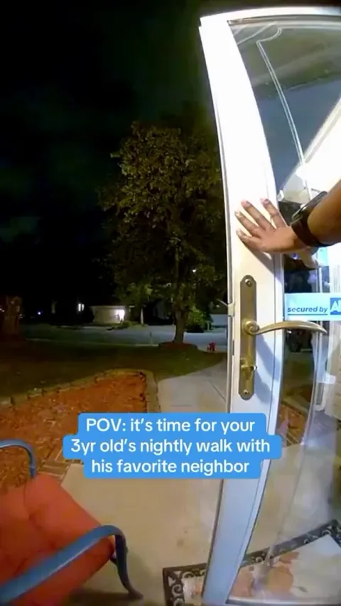 A little boy looks forward to his nightly walk with his neighbour and dog