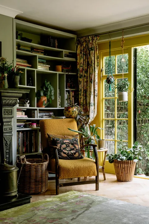 Ground floor flat living room opening up to the garden in an Edwardian building, Highgate, London, UK [1067x1600]