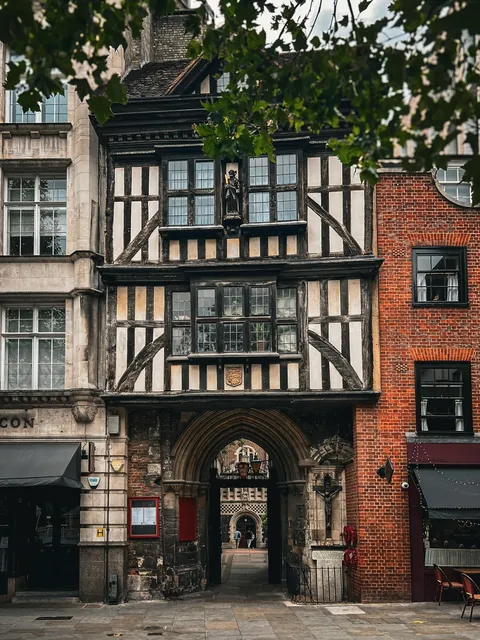Rare surviving Tudor gatehouse, built in 1595 atop a 13th-century stone arch that formed the original priory entrance to the Priory Church of St Bartholomew the Great, City of London, UK.