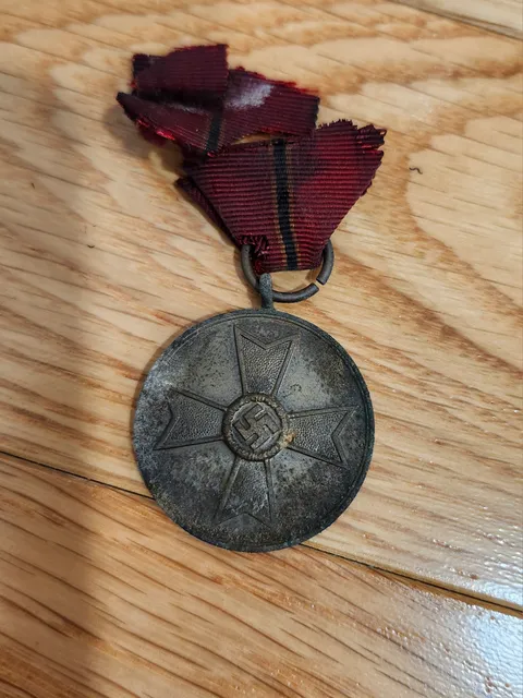 I was cleaning my radiators in my house when a nazi medal fell out.