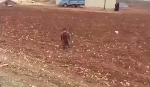 Turkish soldier gives chocolate to a Syrian child. When one of the bars drops... he even picks it up and thinks he has to give it back. He showed kindness and waved him goodbye in the end.