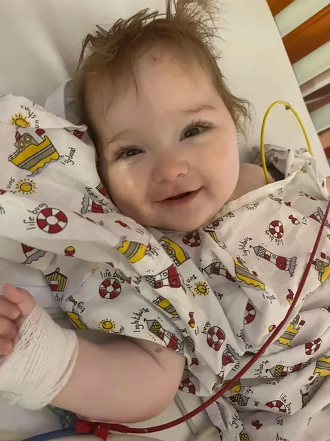 My 8 month old daughter woke up after brain surgery smiling [OC]