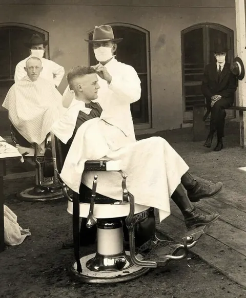 An open air barber shop during the 1918 flu pandemic at the University of California, Berkley.