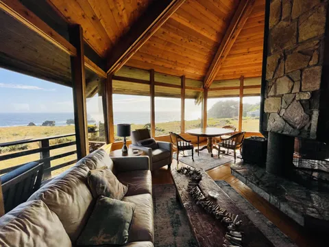 Fireplace, calm ocean, hot coffee, book, and Miles Davis…my cozy place