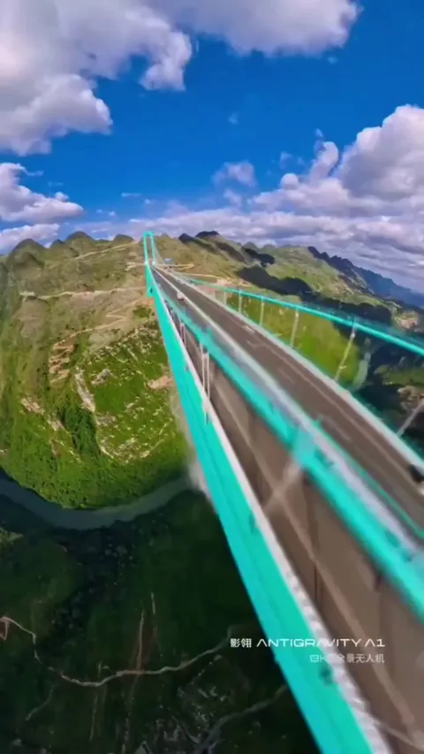 Waterfall from the Guizhou Huajiang Canyon Bridge, the highest bridge in the world.