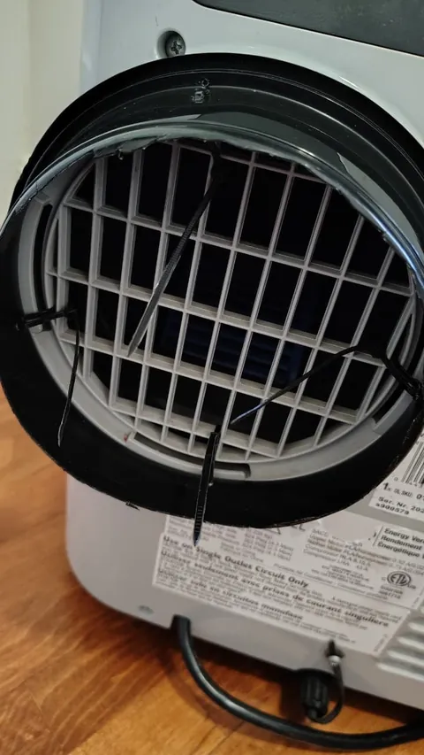 Lost my AC hose adapter in a roasting rental room. Fixed it with a takeout container and zip ties (zero damage/no tools).