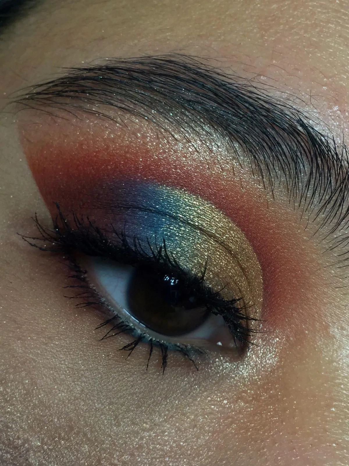 A red and gold cut crease with a pop of blue