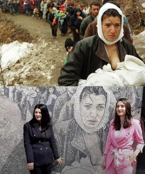 A Kosovo Albanian woman is evacuated with her newborn daughter in a column of refugees, 1999.