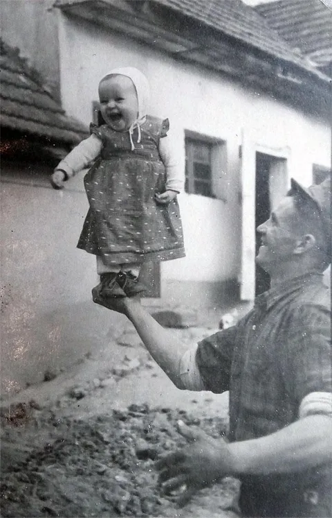 My acrobatically skilled grandfather lifting my mother in 1958