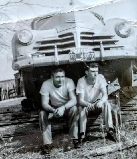 My grandpa and his dad in Alabama, 1954