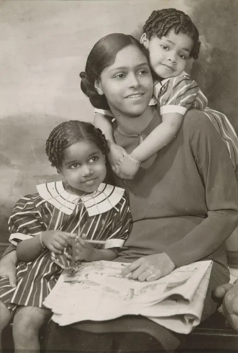 Mother posing with her children, circa 1932.