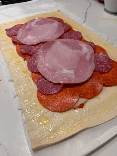 [homemade] Stromboli! Thin layer of marinara, Genoa salami, pepperoni and ham with provolone cheese.